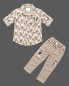 Boys button-down shirt and cargo pant set designed as party wear for boys with tropical print and chest embroidery.