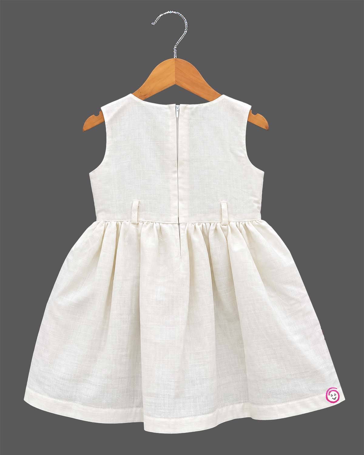 Little girl off-white and pink floral embroidered cotton dress paired with a cropped pink short sleeve jacket