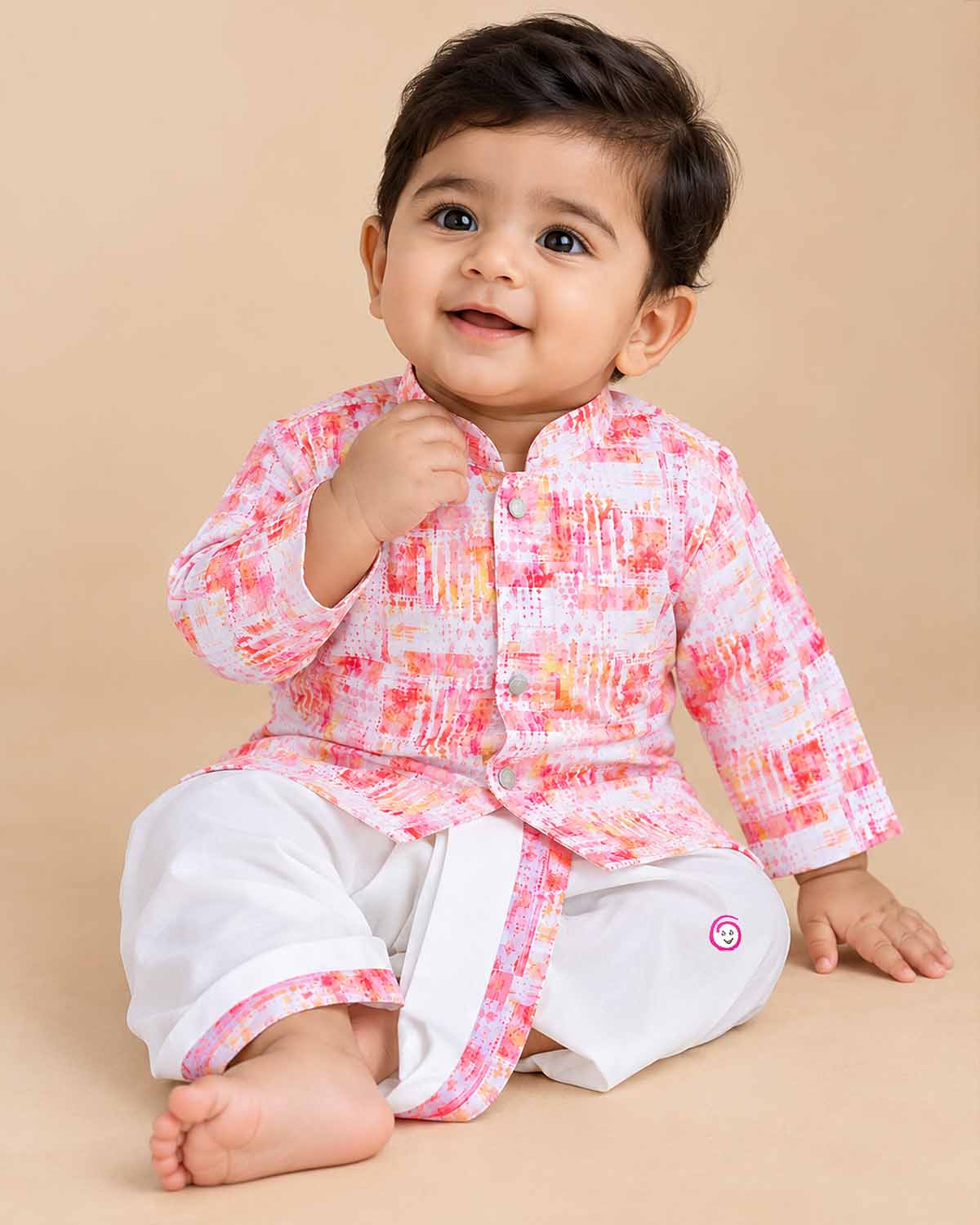 Baby boy wearing a mandarin collar printed kurta and elastic pyjama set for festive celebrations.