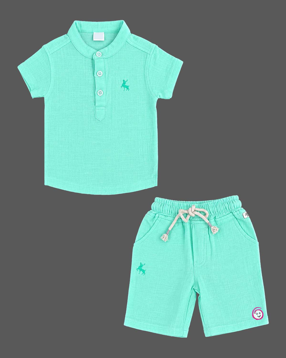 Toddler wearing kids western wear consisting of a textured collar top and drawstring shorts.