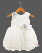 Off-white sequin floral embroidered net party frock with waist bow for baby girls grand celebrations, temple visits, and family festivals