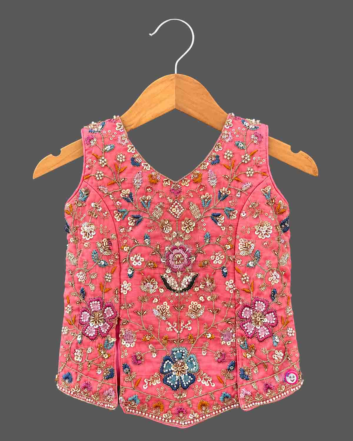 Kids sharara set featuring sleeveless hand-embroidered top, flared palazzo pants, and matching dupatta.