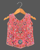 Kids sharara set featuring sleeveless hand-embroidered top, flared palazzo pants, and matching dupatta.