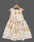 Little Girl Casual Frock featuring a cream dress with patterns and a peachish-pink textured shrug/jacket with a flower brooch and tie-up front.