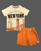 Light yellow graphic t-shirt with New York cityscape print and rust orange elasticated shorts baby boy top and shorts set for summer vacations, playdates, and park outings