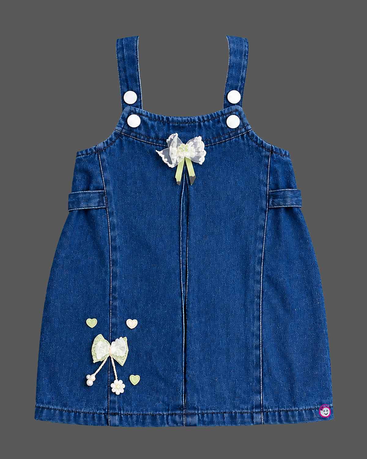 Baby party wear dress featuring a denim pinafore with bow embellishments and ribbed inner top for toddlers.