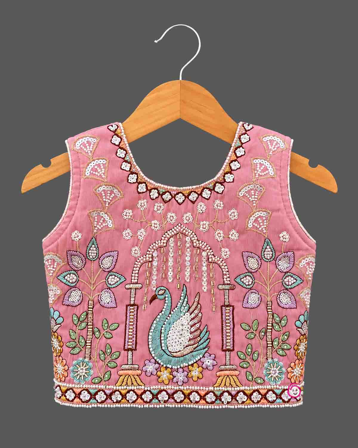 Designer baby girl lehenga set featuring hand-embroidered sequin motifs, sleeveless choli, and pleated flared skirt