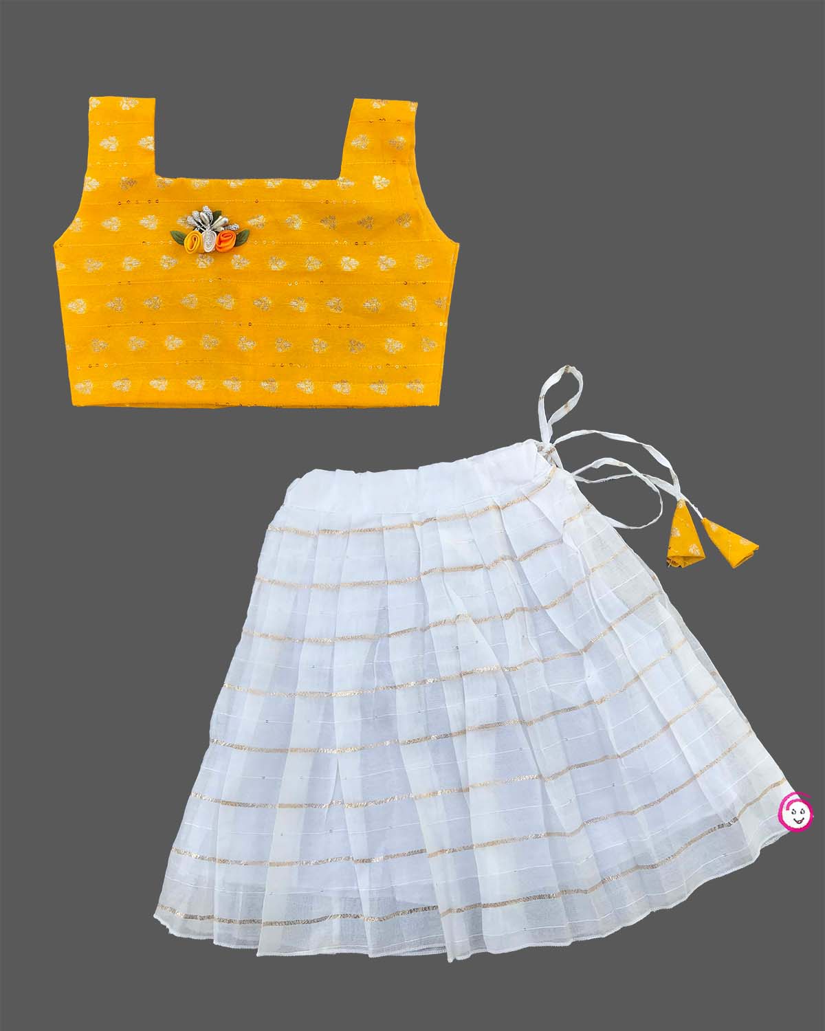 Little one wearing flower applique choli blouse with striped pleated lehenga skirt for festive celebrations