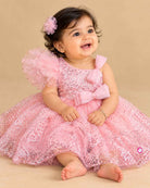 Girls sequin mesh one shoulder party frock with ruffled shoulder and waist bow detail
