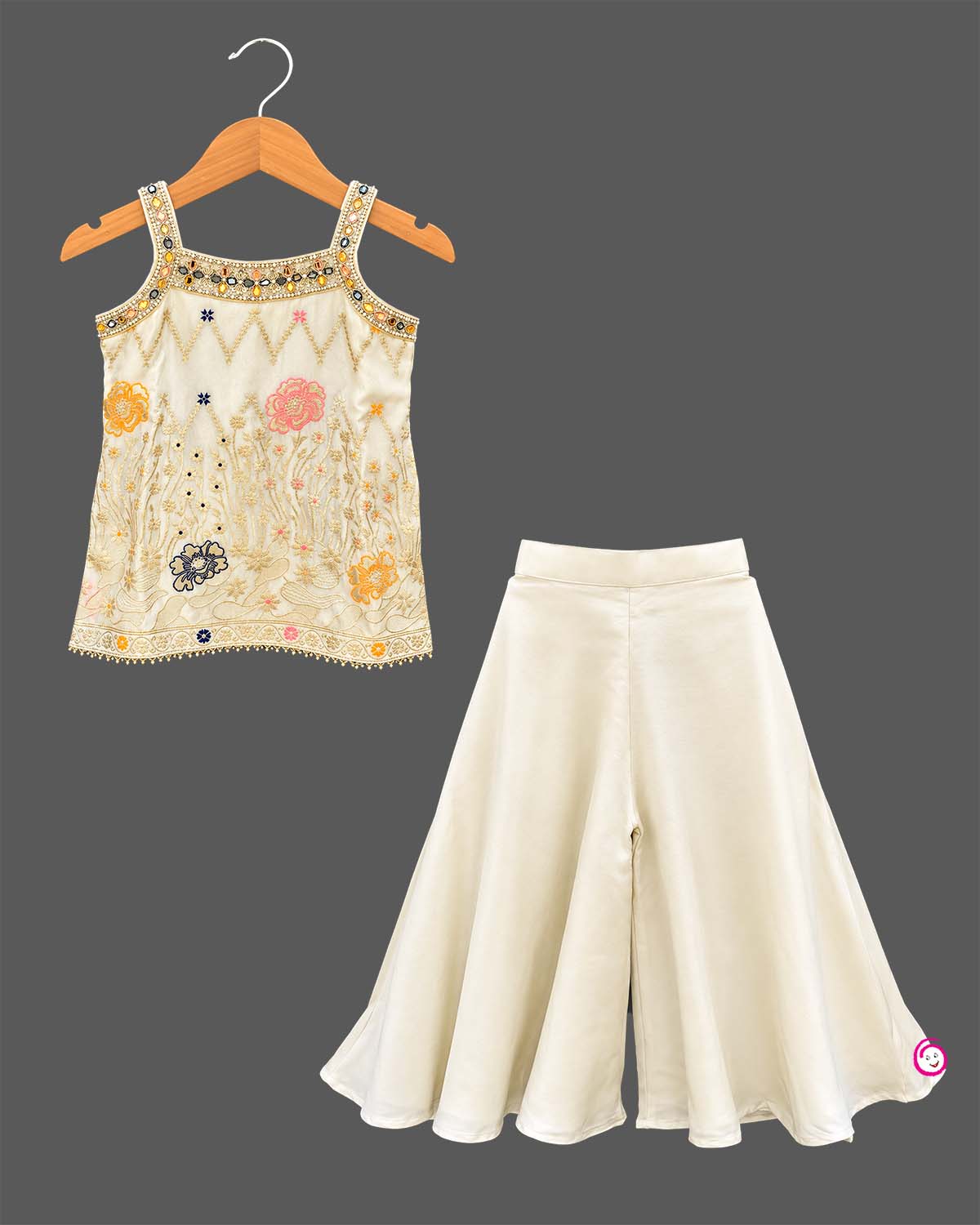 Girls Silk Sharara Set featuring floral embroidered short kurti with wide flared sharara pants for festive wear