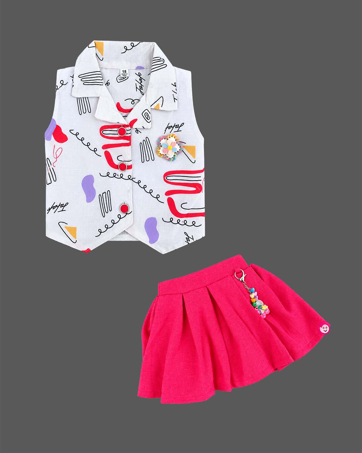 Girls sleeveless printed collar waistcoat with brooch and pleated flared skirt for kids party wear.