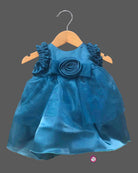 Teal blue shimmer net party frock for toddler girls with ruffled shoulders and center rose flower detail