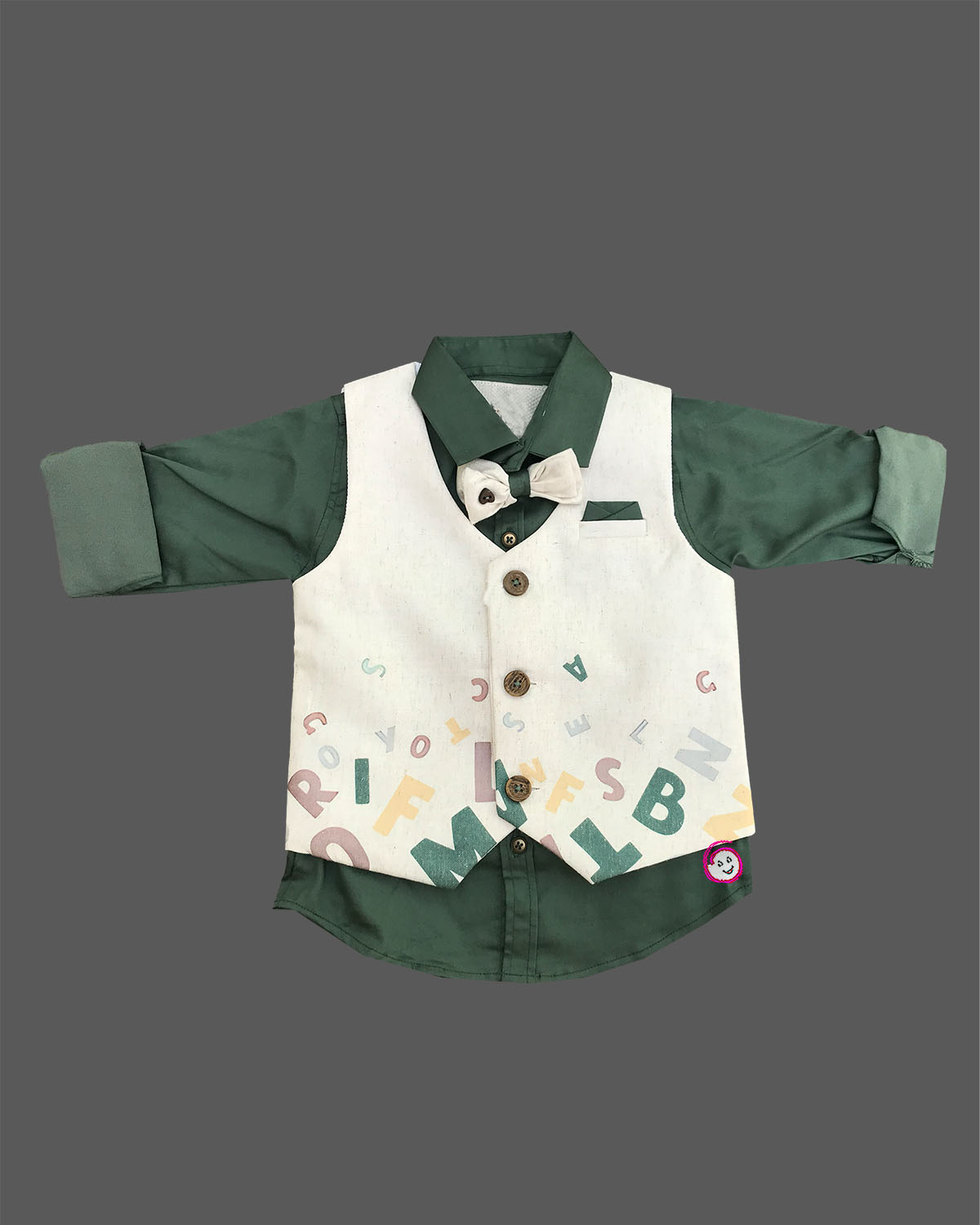 Toddler boys formal alphabet print waistcoat suit set with shirt, bowtie, and trousers flat lay.