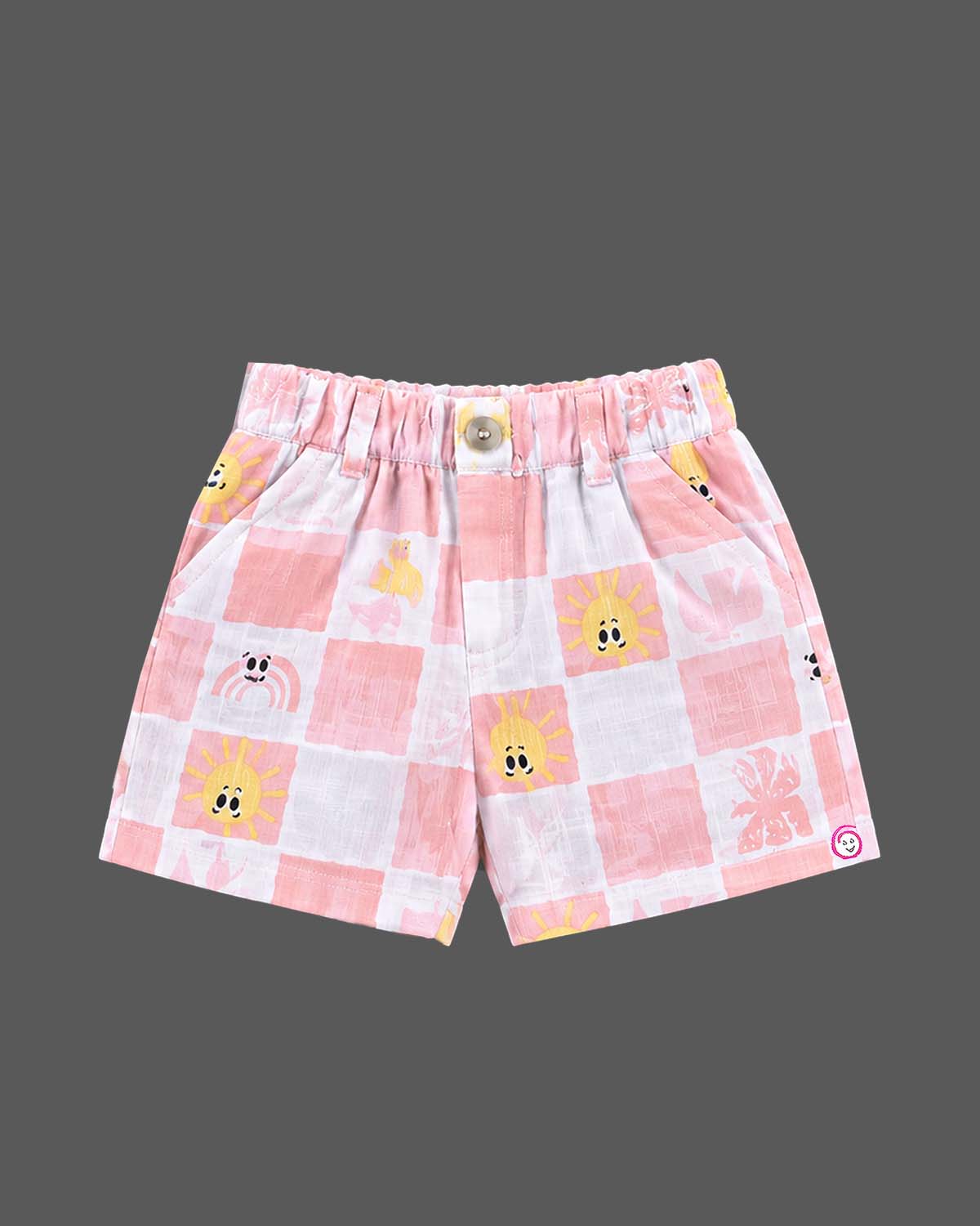 Co-ord set for baby boy featuring a button-down checkered shirt and matching shorts with sun graphics