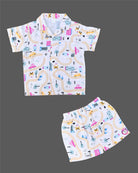 Boys 2-piece cotton casual co-ord set featuring a short-sleeve collared printed shirt and matching shorts in white with colorful cars, roads, and buildings print