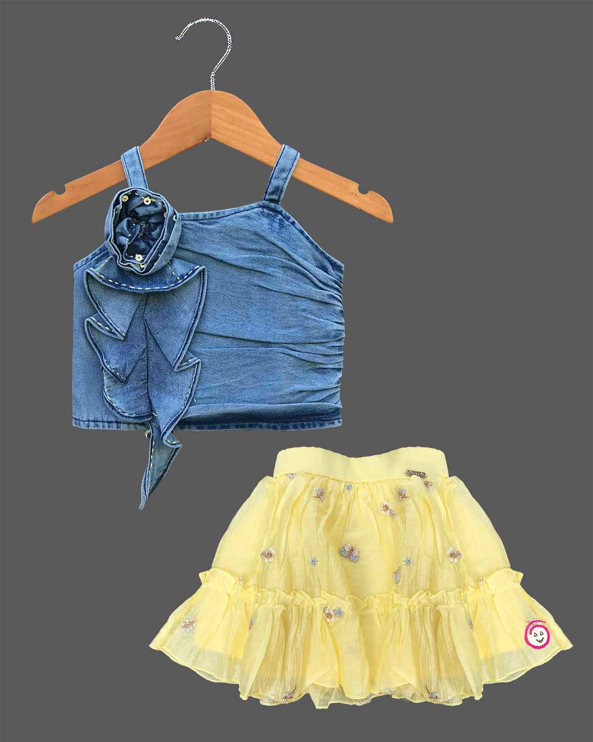 Girls blue denim strappy top with ruffle flower and yellow net embroidered skirt set