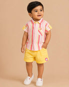 Boys 2-piece cotton casual set featuring a short-sleeve pink, yellow, and coral striped shirt and matching solid yellow elastic-waist shorts