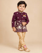 Little boy wearing purple and gold embroidered silk sherwani suit for weddings and festive functions