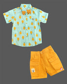 Boys attire featuring a tropical pattern button-down shirt, cargo style shorts, matching neck bow, and adjustable floral motif suspenders.