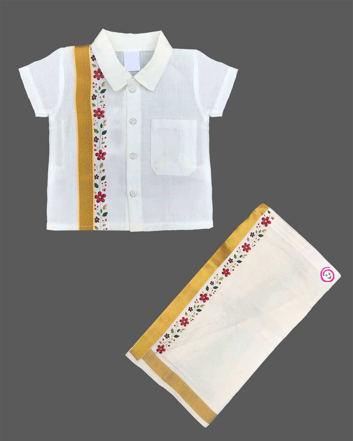 Dapper traditional Indian outfit for young boys featuring a short-sleeved collared shirt with zari trims and floral embroidery paired with a matching golden-bordered dhoti.