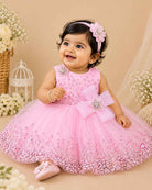 Girls sleeveless tulle party frock with sequined bodice embroidery, pearl flower applique bow, and flared net skirt