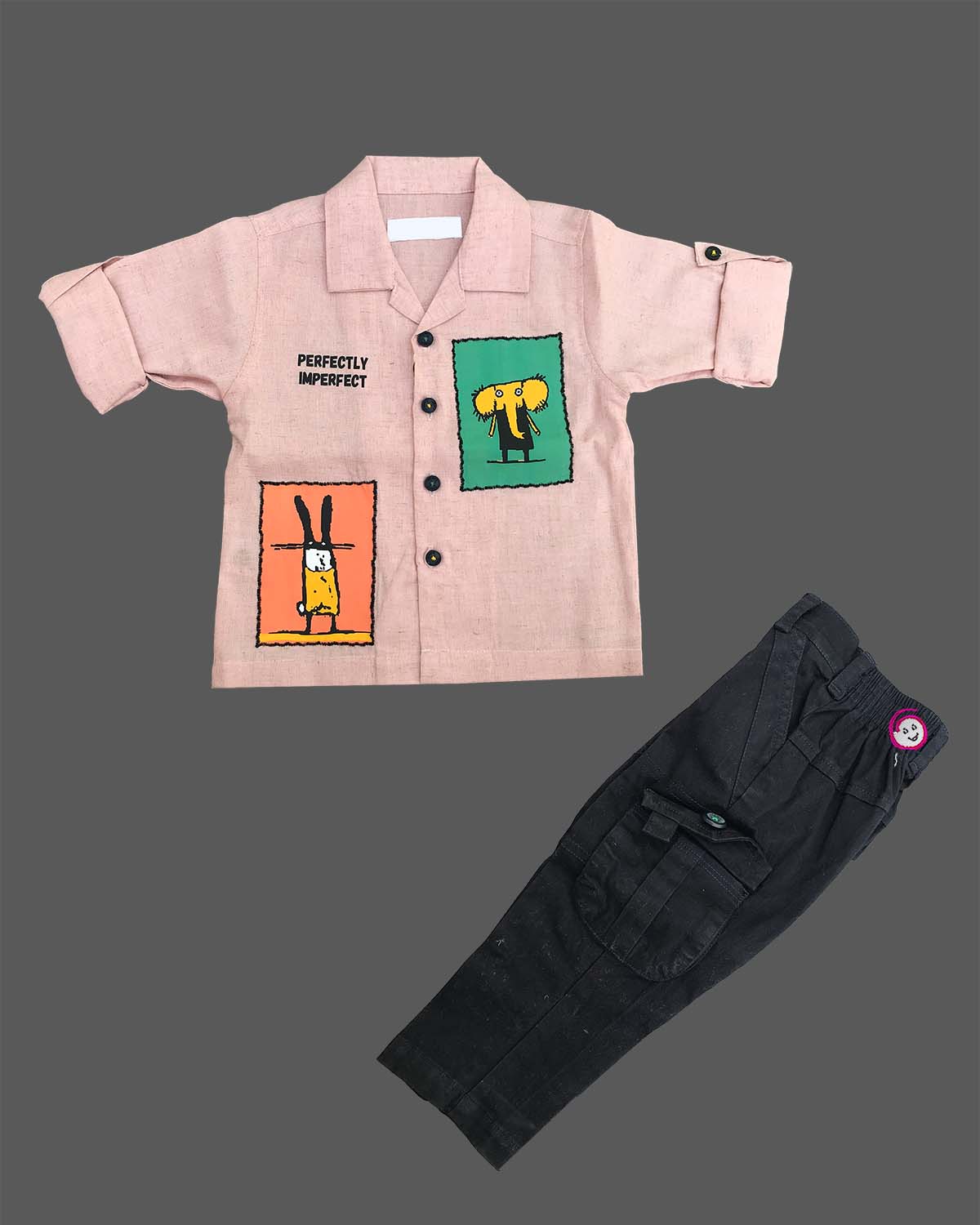 Boys graphic printed button down shirt with roll up sleeves paired with matching cargo pants