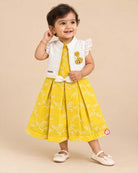 Toddler girl in mustard yellow cotton embroidered casual frock with off-white ruffled jacket