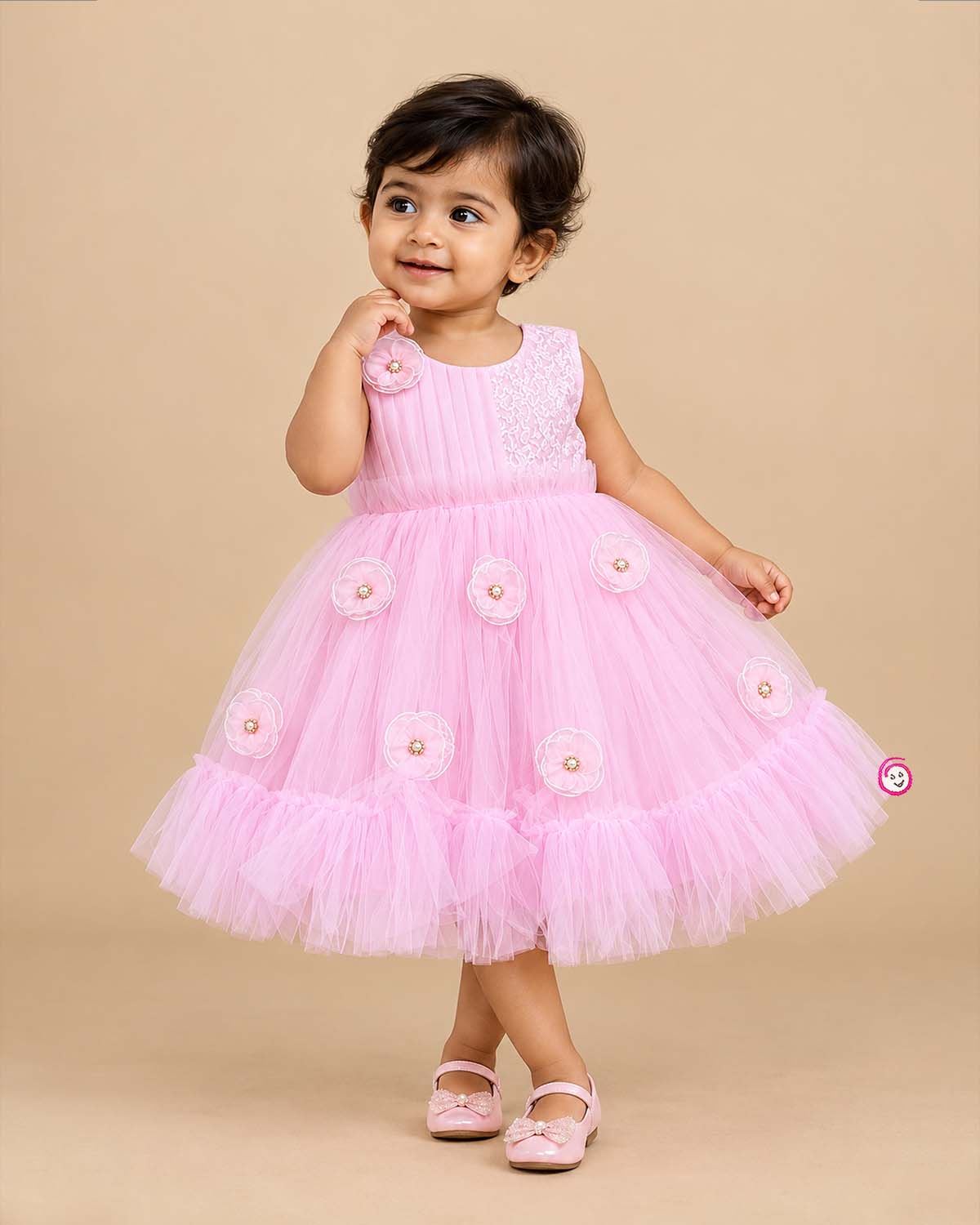 Little girl in soft pink net frock with floral appliqués and shimmer bodice for birthday parties