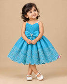 Sky blue embroidered net party frock for girls with bow detail and scalloped hem