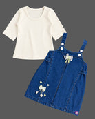 Baby party wear dress featuring a denim pinafore with bow embellishments and ribbed inner top for toddlers.
