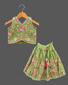 Sleeveless floral embroidered top with curved V-hem and matching pleated choli for kids skirt with sequin work.