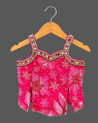 Kids sharara set featuring strappy embroidered top with mirror work trim and wide flared palazzo pants.