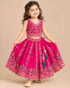 Detailed view of sleeveless embroidered lehenga choli for kids featuring scalloped floral hems.