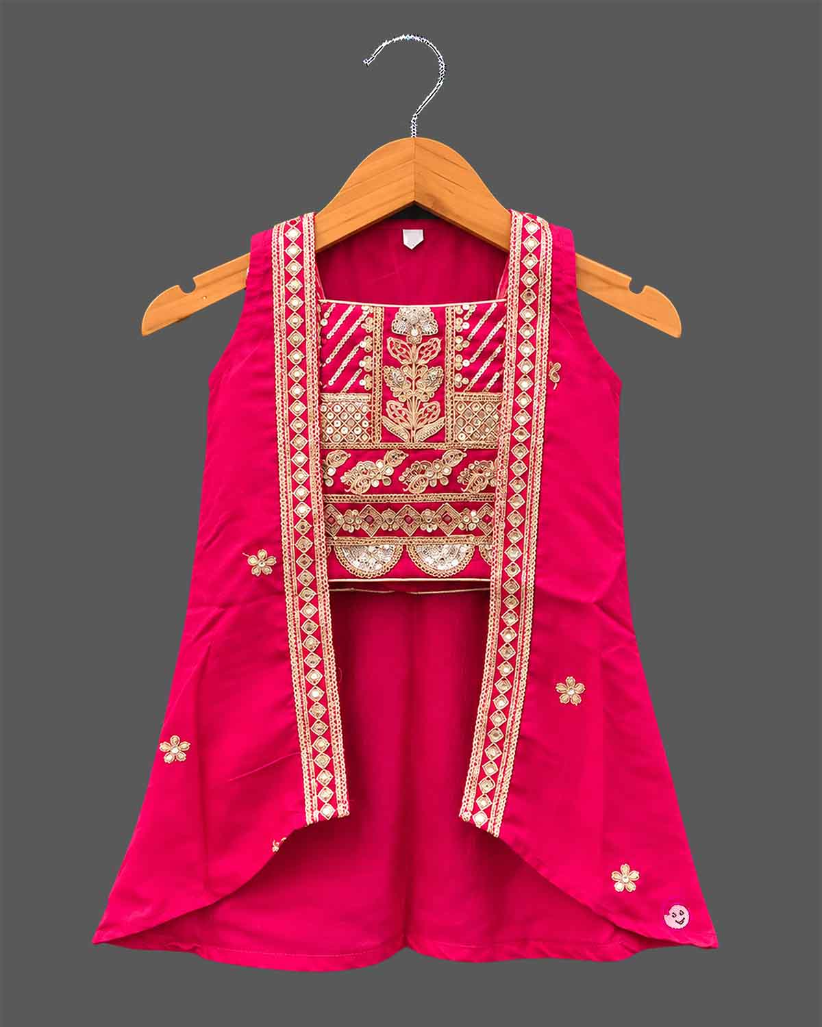 Girls embroidered choli top, flared lehenga skirt, and matching open-front sleeveless jacket.