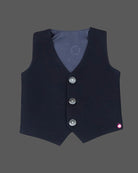 Boys blue designer tuxedo suit set featuring a shawl collar blazer with intricate gold shoulder embroidery, shirt, waistcoat, bow, and matching blue formal pant