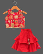 Girls floral embroidered sleeveless choli paired with a tiered ruffled skirt and tassel drawstring accent.