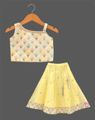 Girls sleeveless embroidered choli with square neck and flared ghagra skirt featuring tassel accents