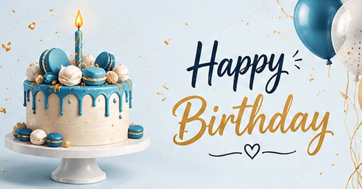 A blue and cream birthday cake with macarons and a candle on a white stand, next to balloons and the text 'Happy Birthday' on a light blue background.