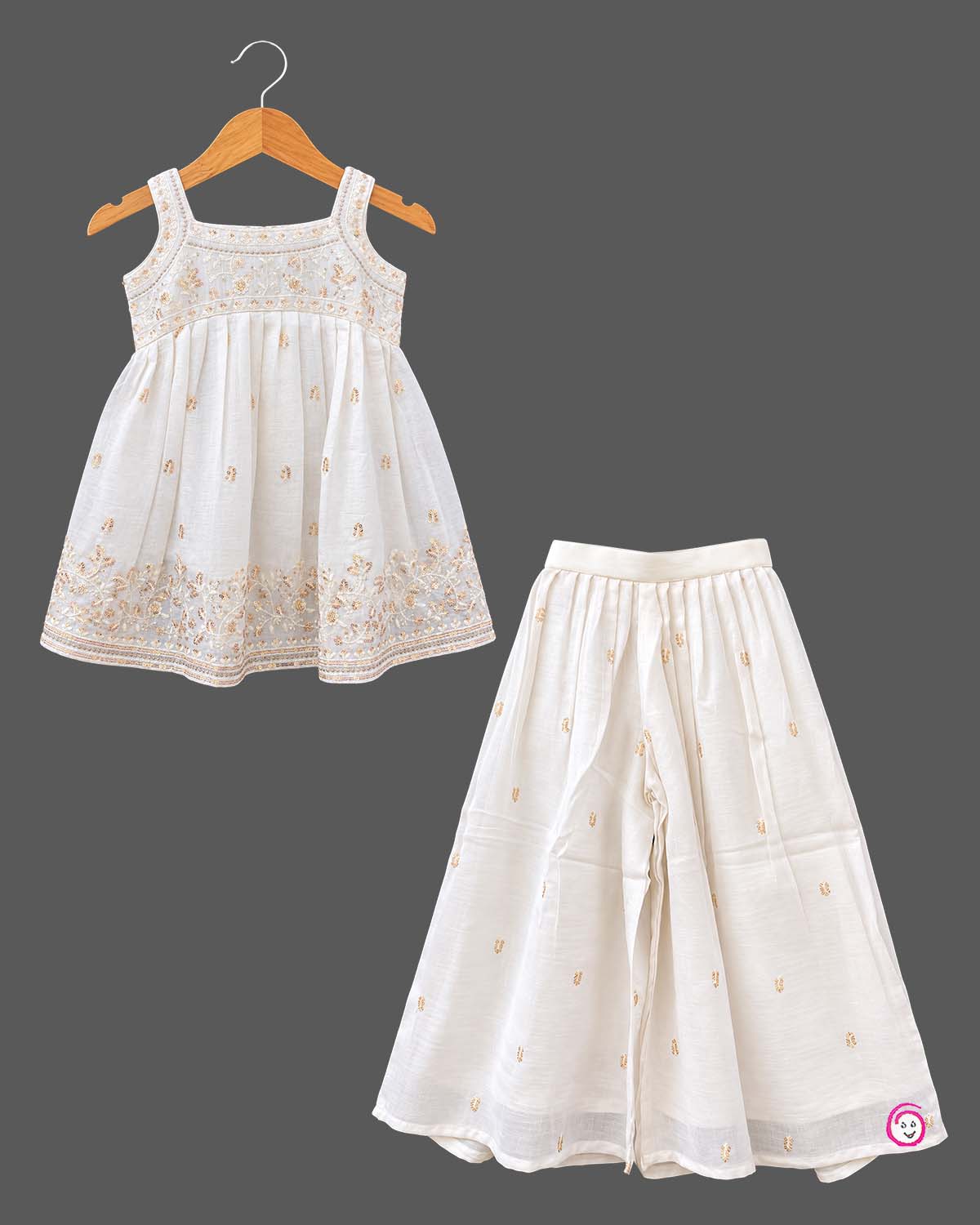 Sleeveless kurti for kids featuring floral embroidery, paired with wide-leg palazzo pants and gold-bordered dupatta.