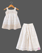 Sleeveless kurti for kids featuring floral embroidery, paired with wide-leg palazzo pants and gold-bordered dupatta.