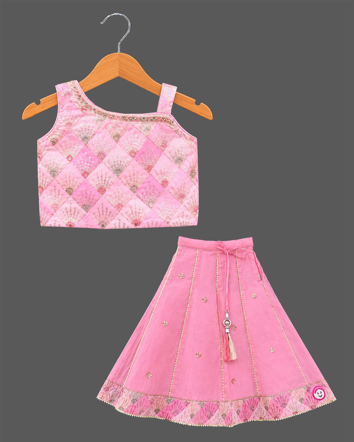 Toddler girls embroidered choli lehenga set with tassel drawstring and flared hem border.