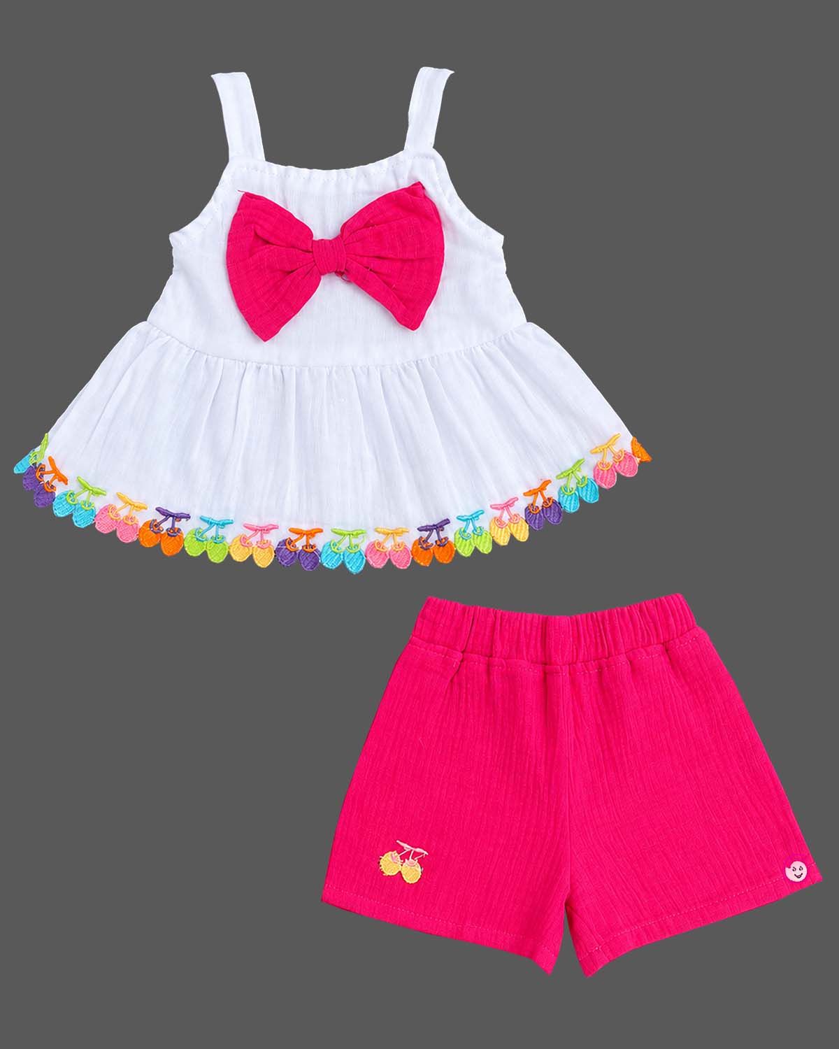 Baby party wear dress set featuring a sleeveless strap top with front bow trim and matching shorts.