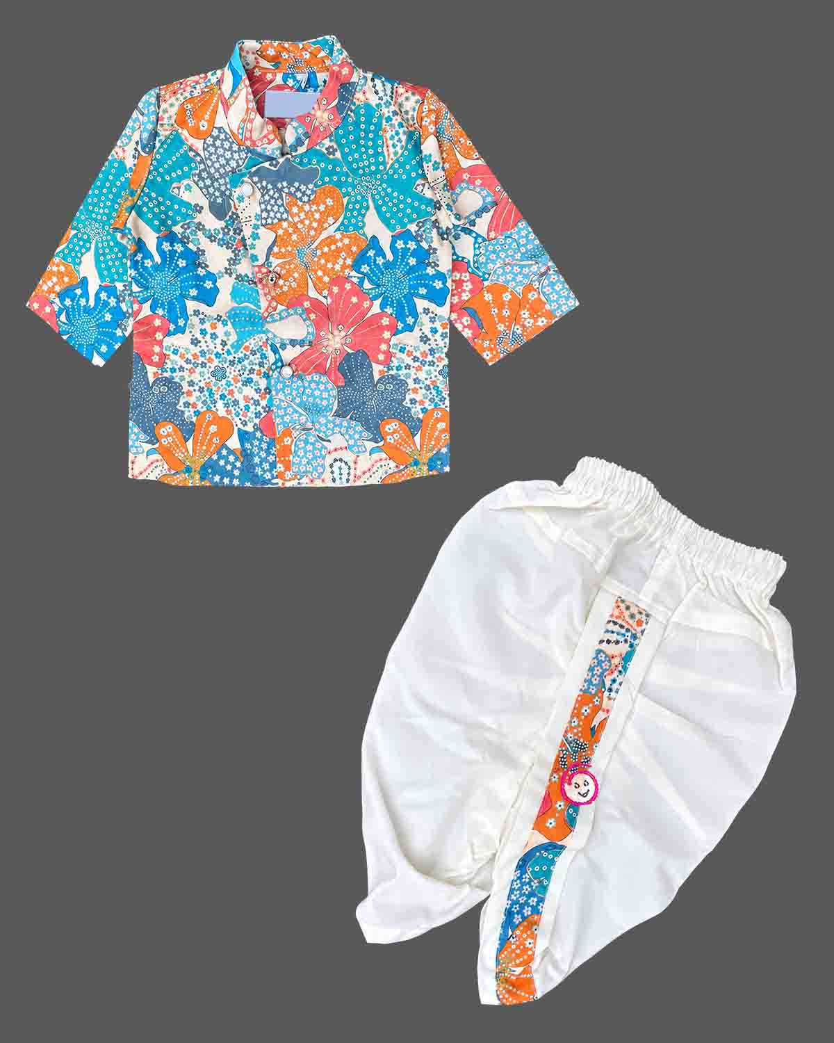Toddler wearing an asymmetric floral print kids dhoti kurta with mandarin collar and pleated bottoms.