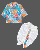Toddler wearing an asymmetric floral print kids dhoti kurta with mandarin collar and pleated bottoms.