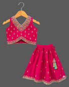 Embroidered V-neck lehenga choli for kids set featuring intricate threadwork, pleated skirt, and sheer dupatta