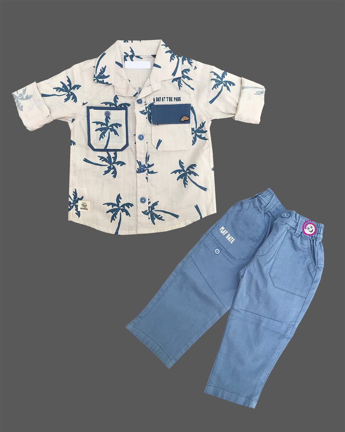 Stylish casual two-piece outfit for little gentleman featuring a printed button-down collared shirt with chest pockets and matching elasticated Pant.
