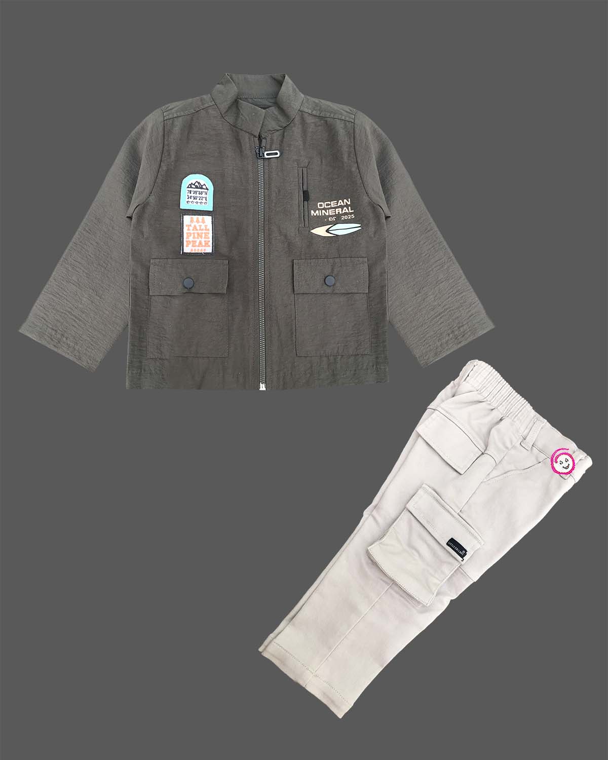 Modern two-piece casual set for toddler boys featuring a zip-front high-neck shirt jacket with graphic patches alongside matching cargo pants.