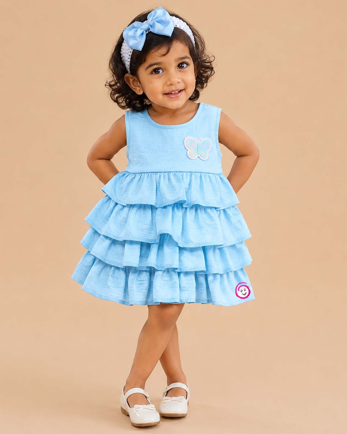 Light blue tiered ruffled baby girl party wear frock with butterfly applique for birthdays, weddings, and special occasions