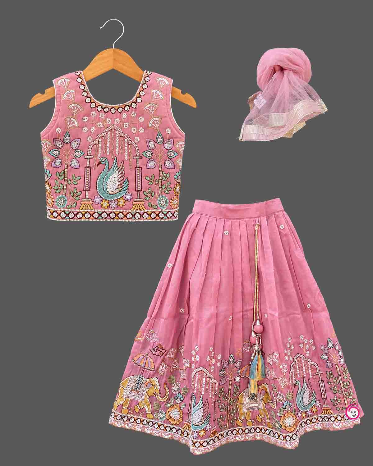 Designer baby girl lehenga set featuring hand-embroidered sequin motifs, sleeveless choli, and pleated flared skirt