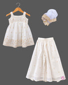 Sleeveless kurti for kids featuring floral embroidery, paired with wide-leg palazzo pants and gold-bordered dupatta.